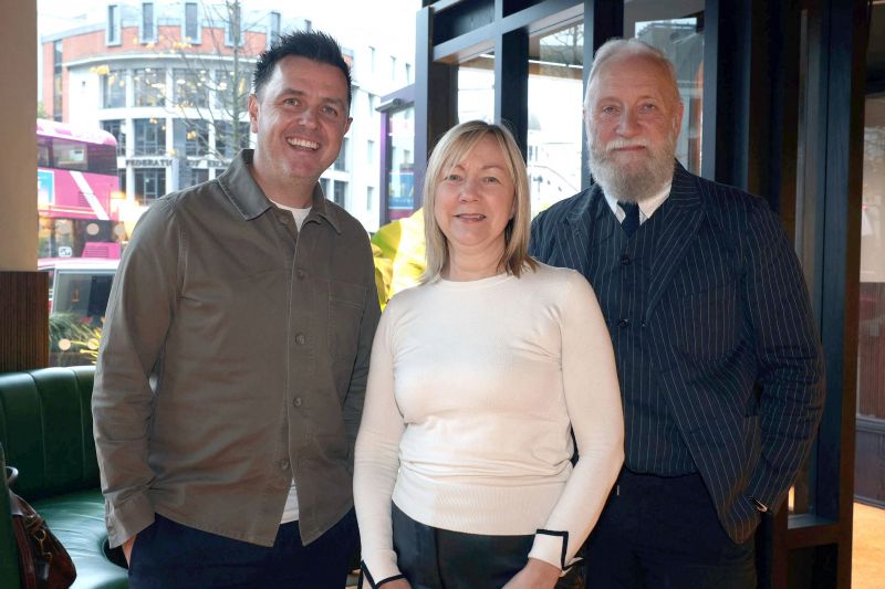 Pete Snodden and Professor Paul Moore taking a picture with Pete\'s old UU Lecturer Carol Reid in Academy Restaurant Belfast 