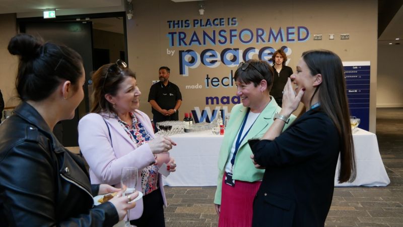 three people networking at event