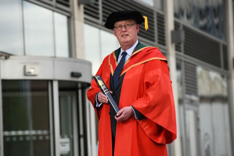 PSNI Chief Constable Sir George Hamilton receives honorary degree from Ulster University image