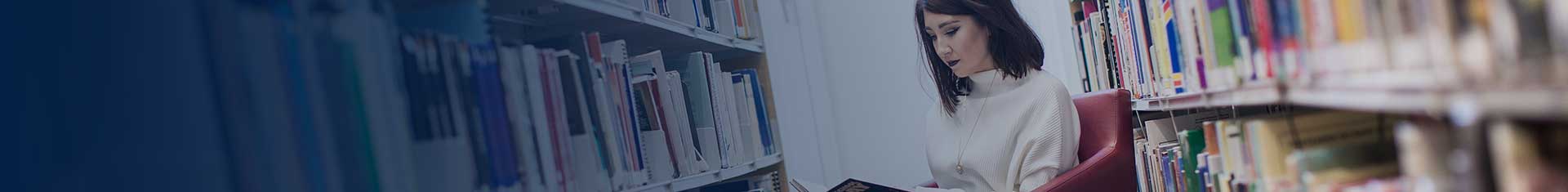 Girl reading books in library