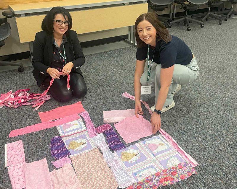 Two female participants designing patchwork quilt