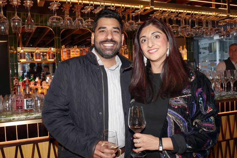 Ulster University Graduates taking a picture in front of bar at the Academy Restaurant in Belfast during the Pete Snodden event 