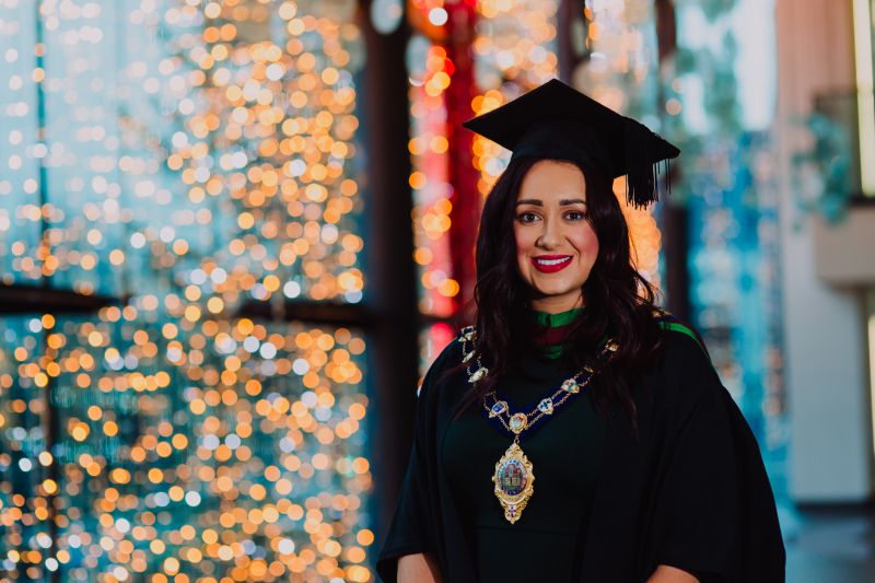 Ulster University student swaps mayoral robes for graduation gown image